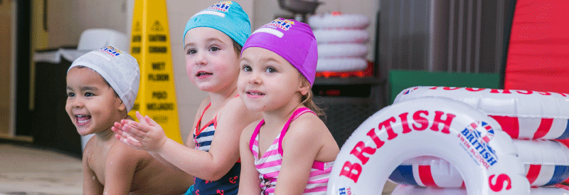 Three kids by a pool